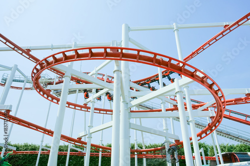 Funny with Roller Coaster in amusement park