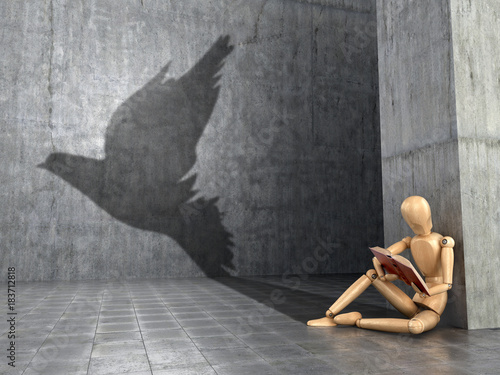 The concept of a flight of fantasy, free-thinking, dreams and self-development. A wooden figure of a man who reads a book and casts the shadow of a bird. 3D illustration