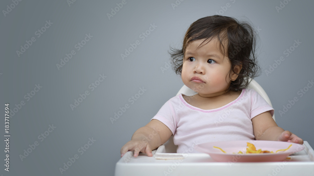 Sweet beautiful baby girl face getting bored of food Sweet beautiful baby girl face getting bored of food