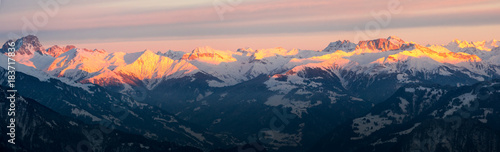 the mountains of the Rhine Valley near Church at sunset in winter panorama view