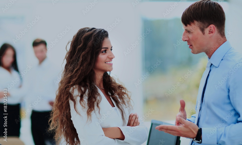 Business - meeting in office, two managers are discussing a docu Business - meeting in office, two managers are discussing a docu