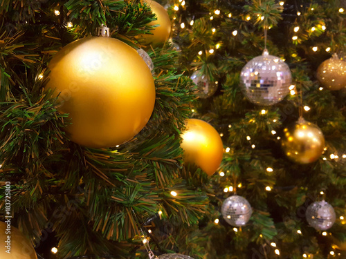 Christmas ball hanging on abstract lights background