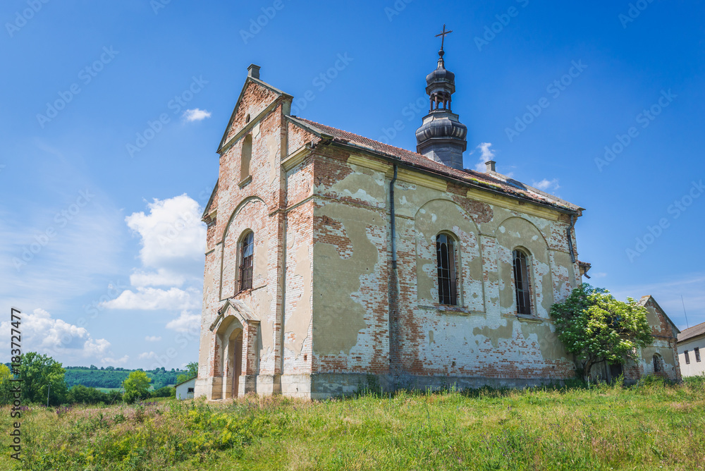Old desolate and ruined Polish church in Ulashkivtsi village, Ukraine