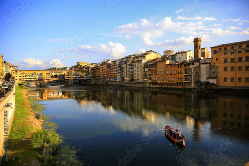 View of medieval stone bridge Ponte Vecchio and the Arno River in Florence, Tuscany, Italy