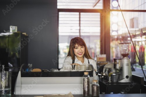 Asian woman working in coffee shop cafe barista concept	