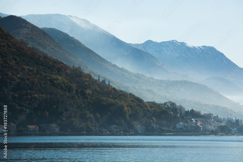 View of the city on the Adriatic sea coast in Montenegro. Misty landscape