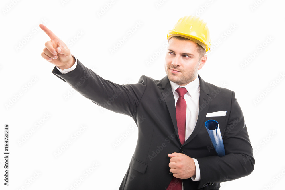 Architect wearing suit and hardhat holding map pointing up Architect wearing suit and hardhat holding map pointing up