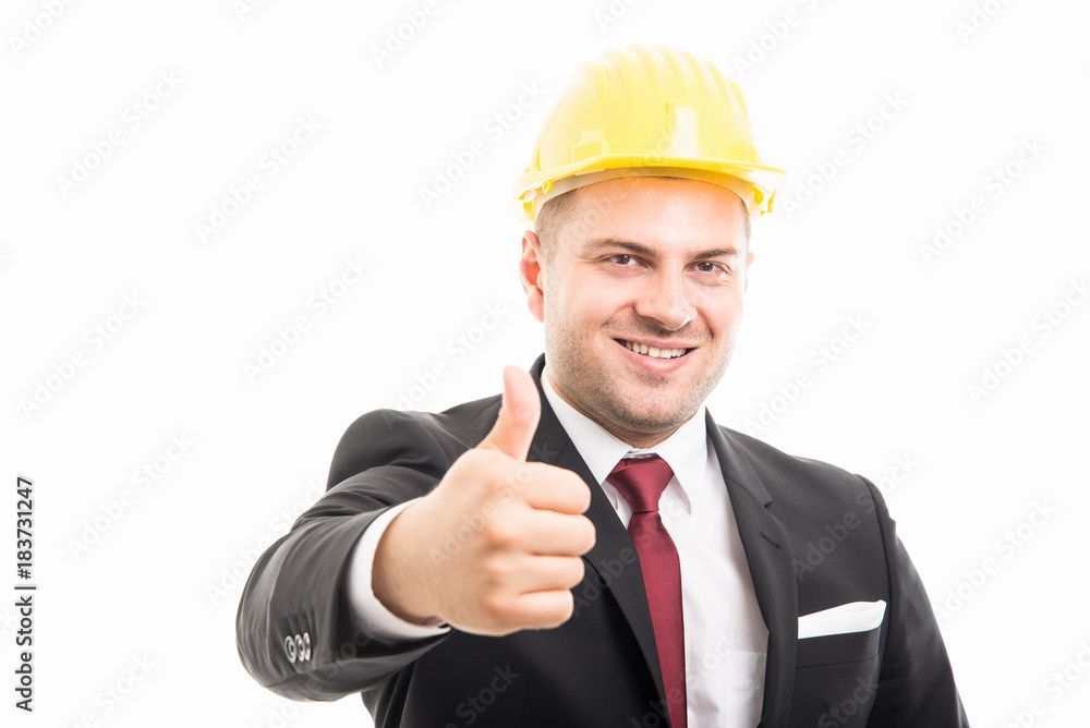 Constructor wearing suit and hardhat showing like gesture Constructor wearing suit and hardhat showing like gesture