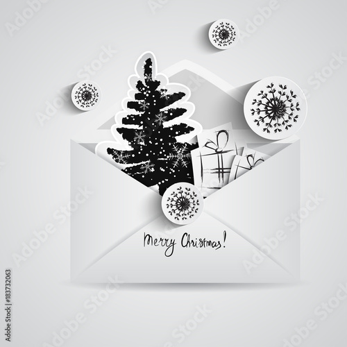 Christmas card with paper snowflakes and Christmas trees inside open envelope. Paper elements in black style
