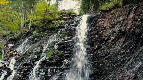 Beautiful autumn waterfall Zhenetskyi Huk in carpathian mountains, Ukraine. Aerial shoot from drone photo