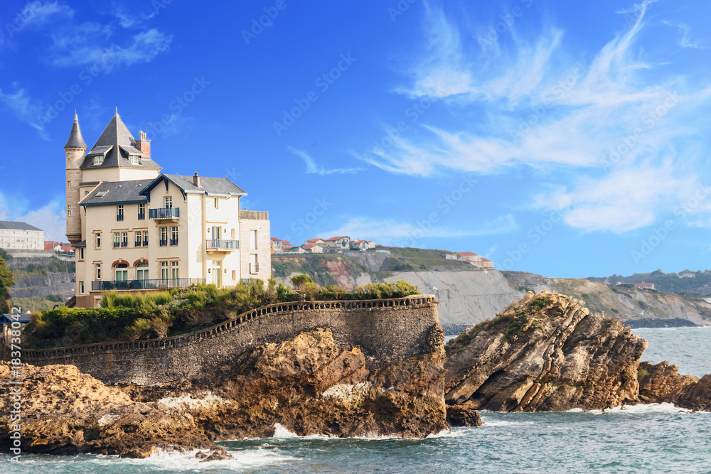 view of the Palace on the rocky beach against the blue sea and sky