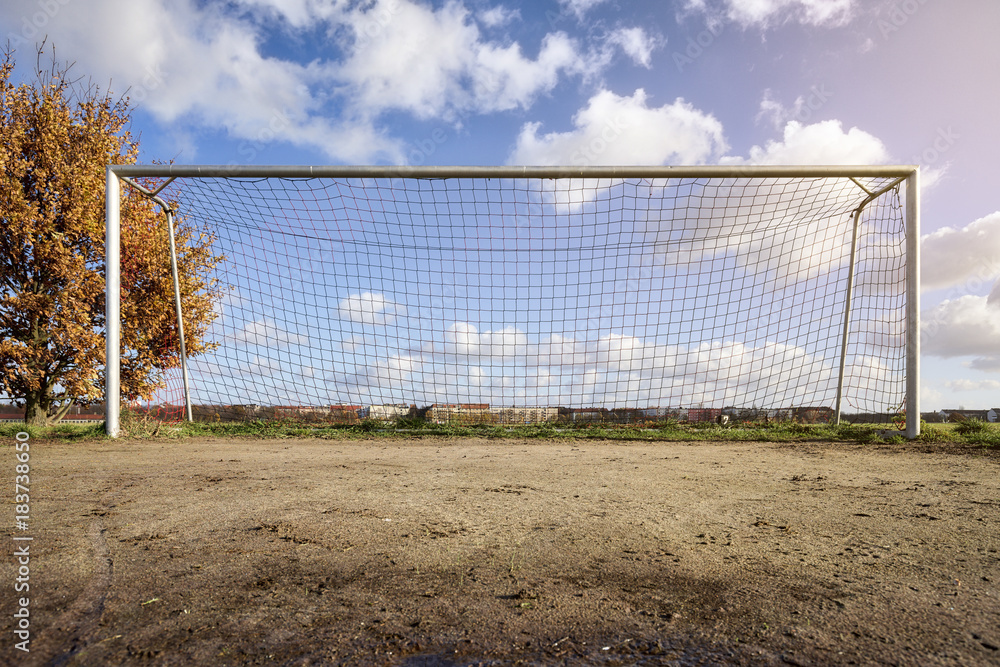 soccer goal with tree, skyline and cloudscape soccer goal with tree, skyline and cloudscape