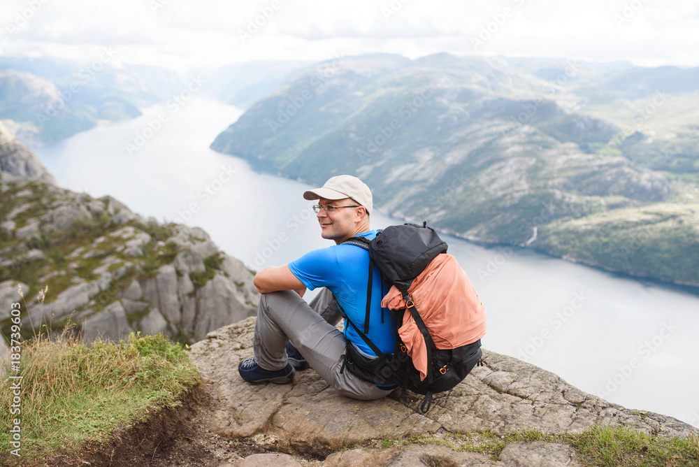 Fototapeta premium Man with Backpack at Lysefjord