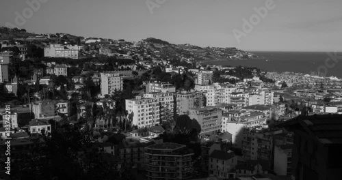 SANREMO, LIGURIA, ITALY, 10 AUGUST, 2017: Black and white Landscape seaside town timelapse, 4K photo