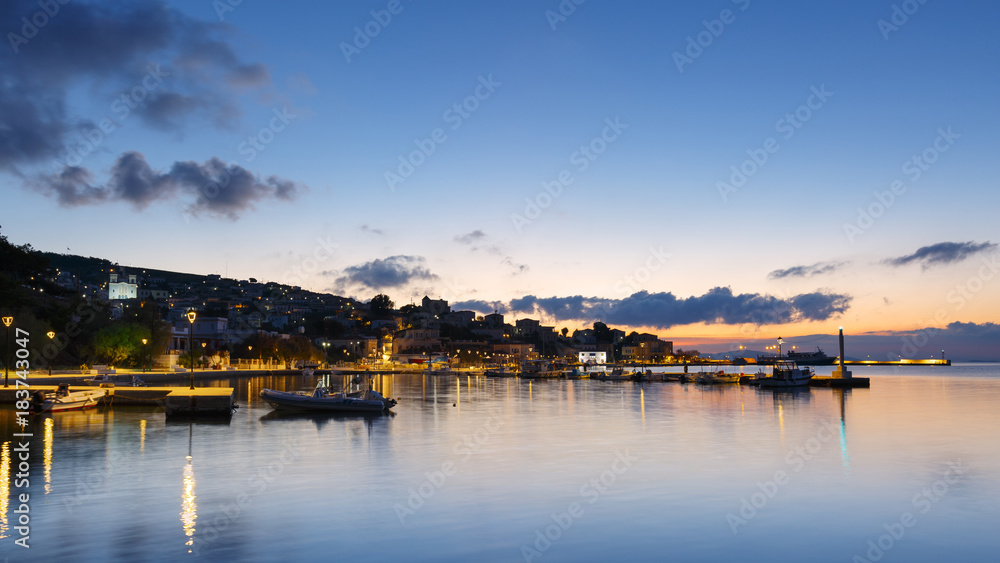 Early morning view of the harbour on Inouses island in Greece.
Early morning view of the harbour on Inouses island in Greece.