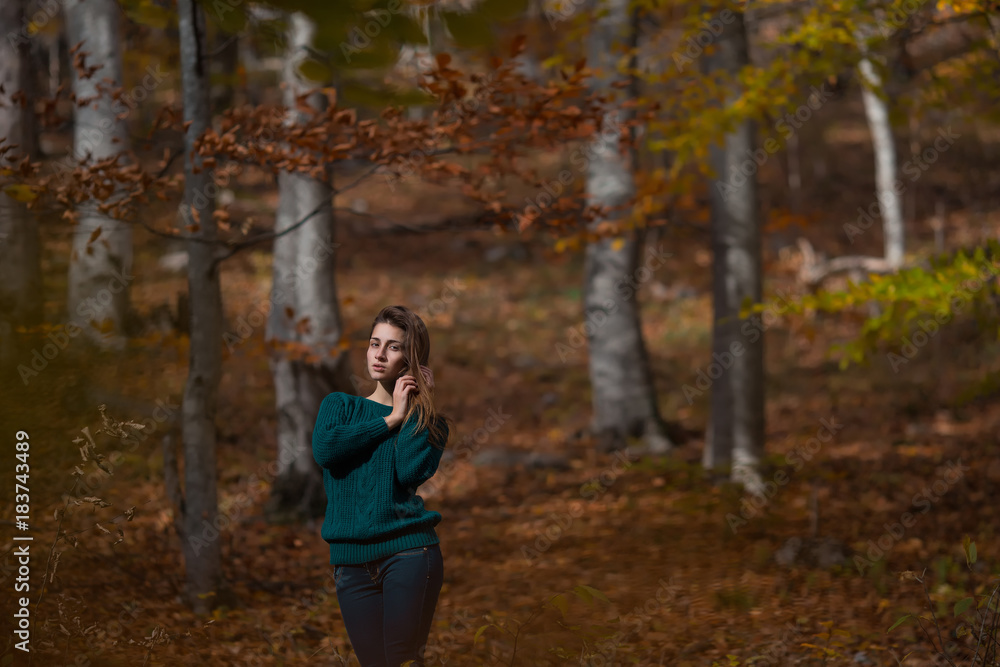 Portrait of young happy woman in casual clothes at the autumn fall forest Portrait of young happy woman in casual clothes at the autumn fall forest