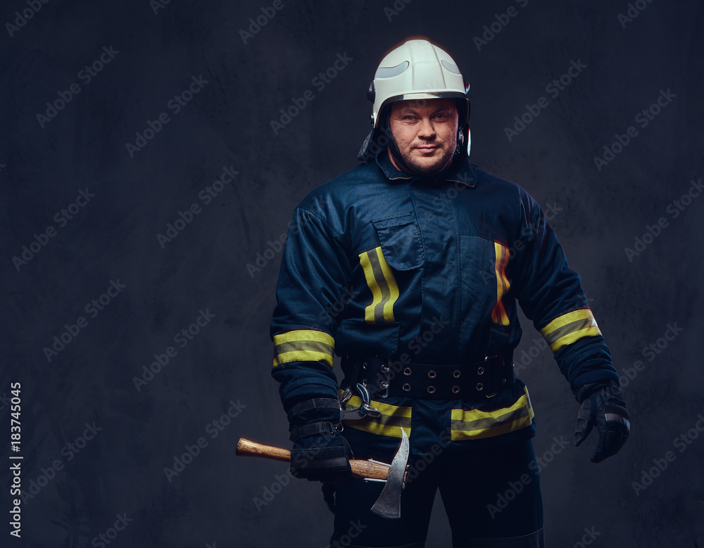 Fototapeta premium Firefighter holds the axe.