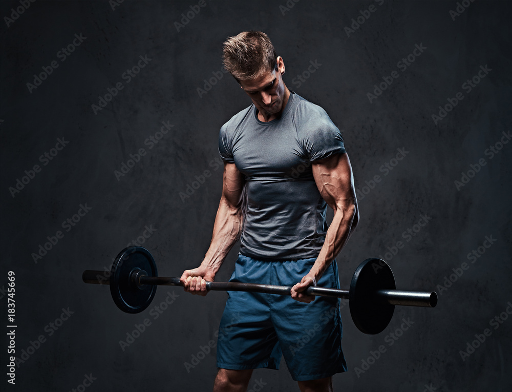 Athletic male biceps barbell workout. Athletic male biceps barbell workout.