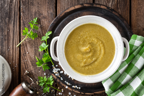 Vegetable cream soup  puree on wooden rustic table  top view