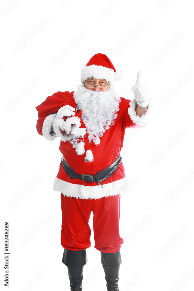 Real Santa Claus carrying big bag full of gifts, isolated on white background Real Santa Claus carrying big bag full of gifts, isolated on white background