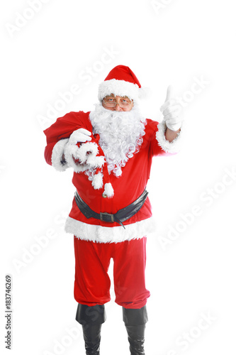 Real Santa Claus carrying big bag full of gifts, isolated on white background © lenets_tan