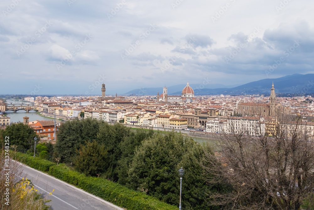 view over Florence from plaza Michelangelo spring cloud by day