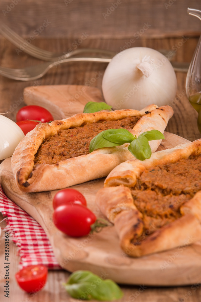 Turkish pide pizza with meat and onion. Turkish pide pizza with meat and onion.