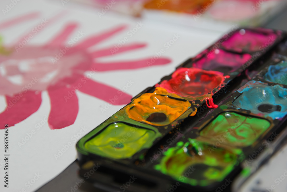 painting with colourful watercolors on the table painting with colourful watercolors on the table