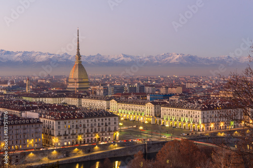 Turin, Italy: cityscape at sunrise with details of the Mole Antonelliana © mariof