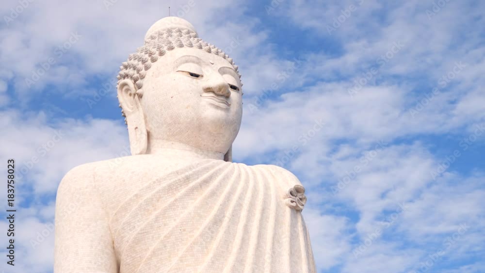 White Big Buddha Temple. Clouds Run in the Sky Over the Sitting Statue. 4K Time lapse. Phuket, Thailand. White Big Buddha Temple. Clouds Run in the Sky Over the Sitting Statue. 4K Time lapse. Phuket, Thailand.