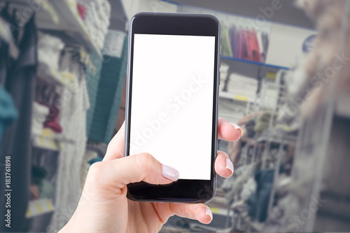 smartphone with a blank screen keeps the woman and shopping in the store