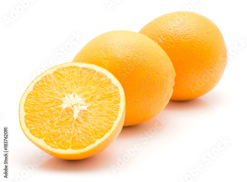 Two oranges in row and one half isolated on white background. photo