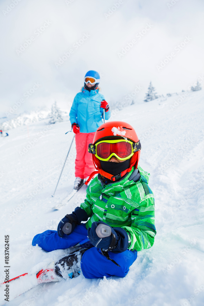 Skier boy in a winter ski resort. Skier boy in a winter ski resort.