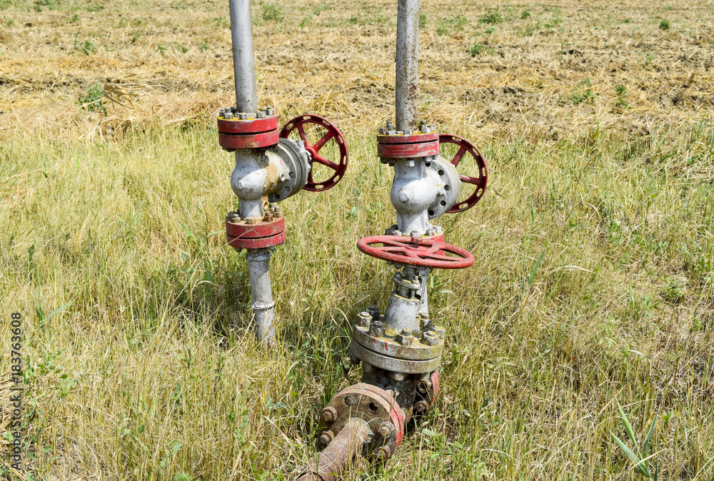 Manual shut-off valve on oil well. Oil well wellhead equipment. Stock ...