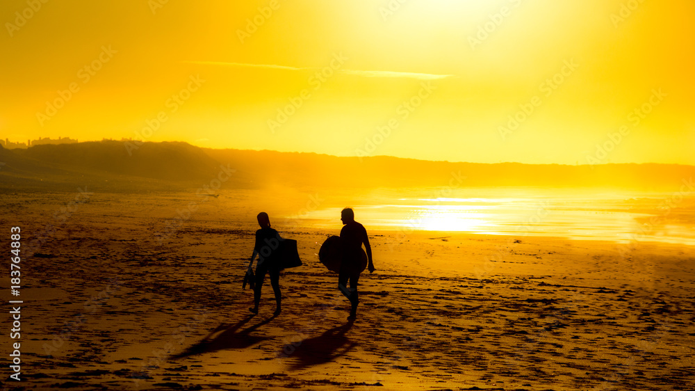 Surfers sunset