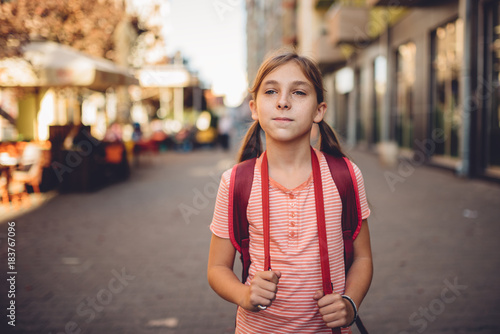 Girl walking to school © kerkezz