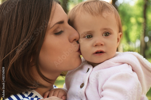 Mother with adorable little...