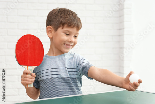Cute little boy playing tab...