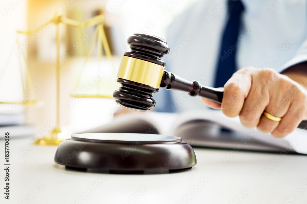 gavel and soundblock of justice law and lawyer working on wooden desk background. gavel and soundblock of justice law and lawyer working on wooden desk background.