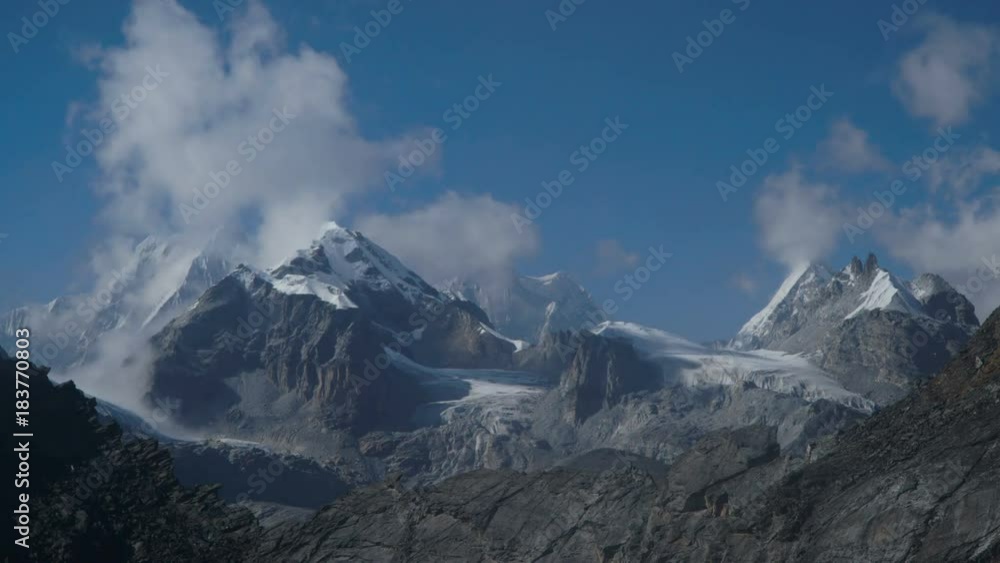Time lapse. Movement of clouds against the background of the Himalayan mountains. Track to the base camp of Everest in the Himalayas. Sagarmatha National Park, Nepal, 4K Time lapse. Movement of clouds against the background of the Himalayan mountains. Track to the base camp of Everest in the Himalayas. Sagarmatha National Park, Nepal, 4K
