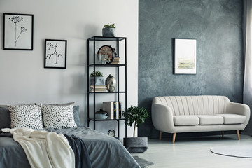 Sofa and drawings in bedroom