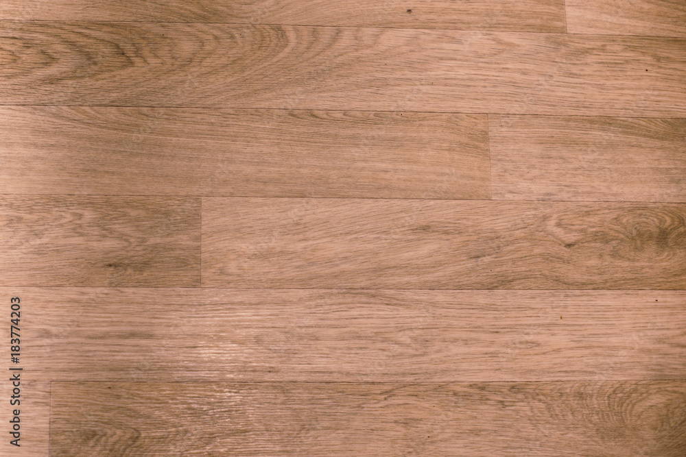Dark wood texture background in wallnut color. . Wood laminate floor varnish decorated in home modern style. Dark wood texture background in wallnut color. . Wood laminate floor varnish decorated in home modern style.