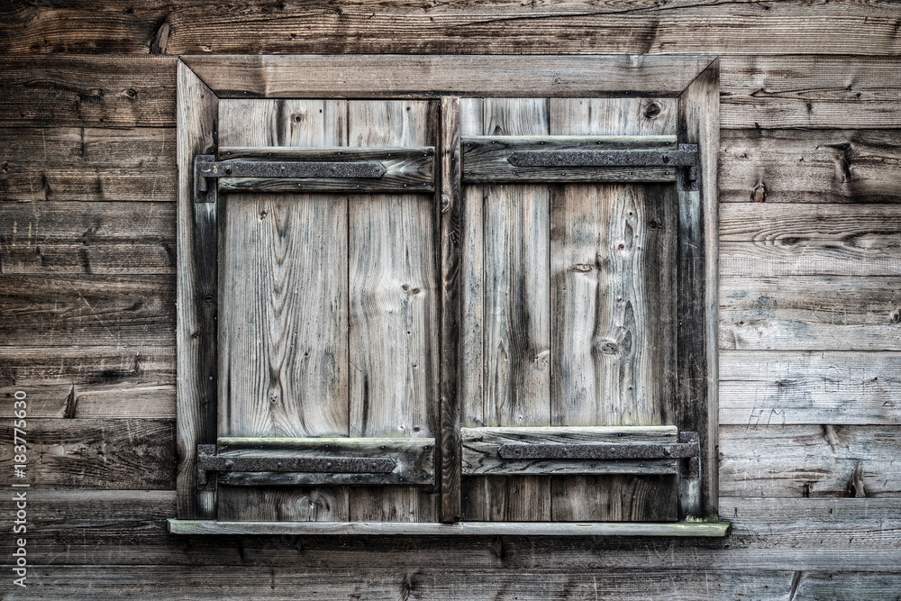 Old wooden window shutters closed Old wooden window shutters closed