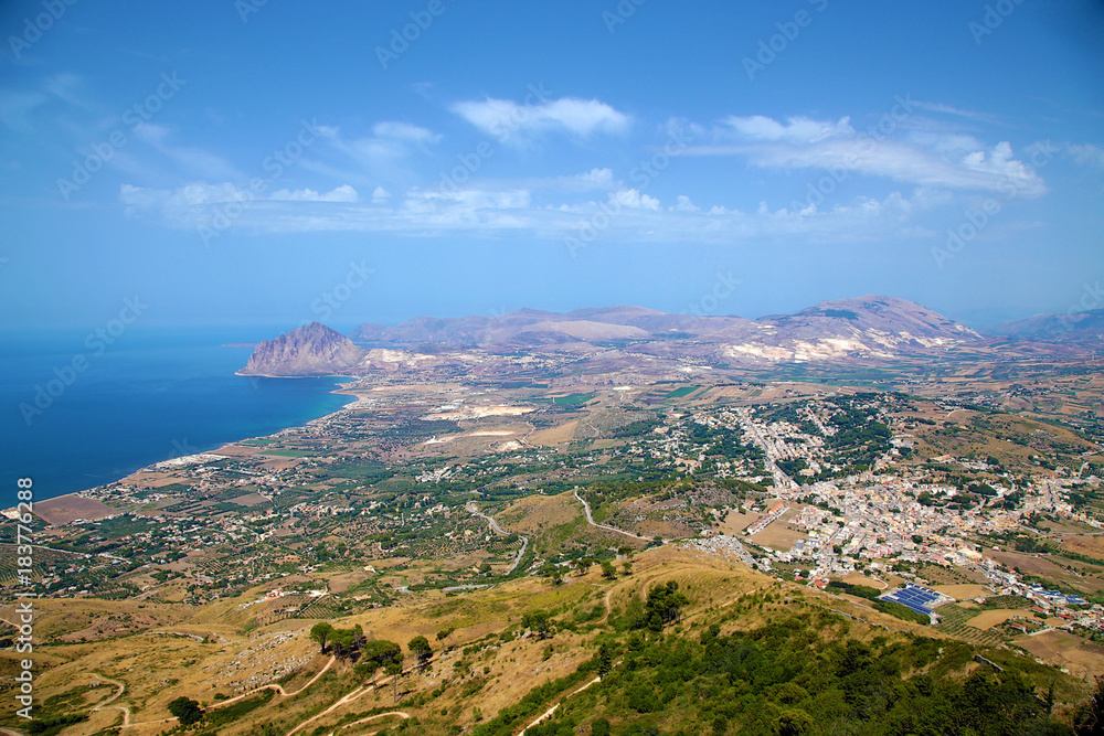 Sicily, Italy. Picturesque landscape of the sea coast. On the right is the town of Valderice
