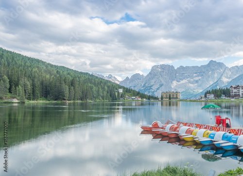 MISURINA, ITALY - AUGUST 11, 2013: Lake reflections on a cloudy summer day. Misurina is a famous location in italian alps
