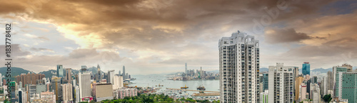 HONG KONG - MAY 12  2014  Stunning panoramic view of Hong Kong Island and Kowloon on a cloudy day. Last year HK hosted more than 54 million visitors  most of them from the mainland