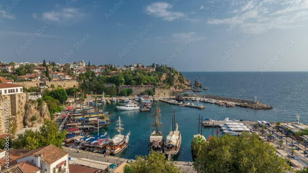 Aerial view of yacht harbor and red house roofs in 