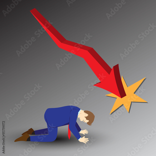 Businessman Kneeling Under Declining Graph