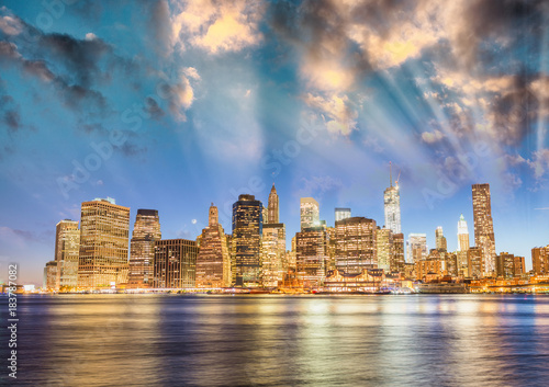 Downtown Manhattan sunset light with river reflections from Brooklyn  New York City