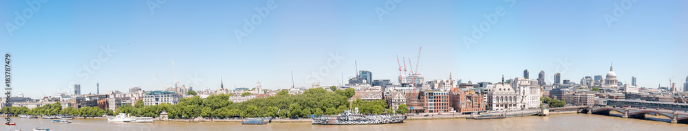 LONDON - MAY 2013: Beautiful panoramic view of city buildings along river Thames. London attracts 30 million tourists annually
